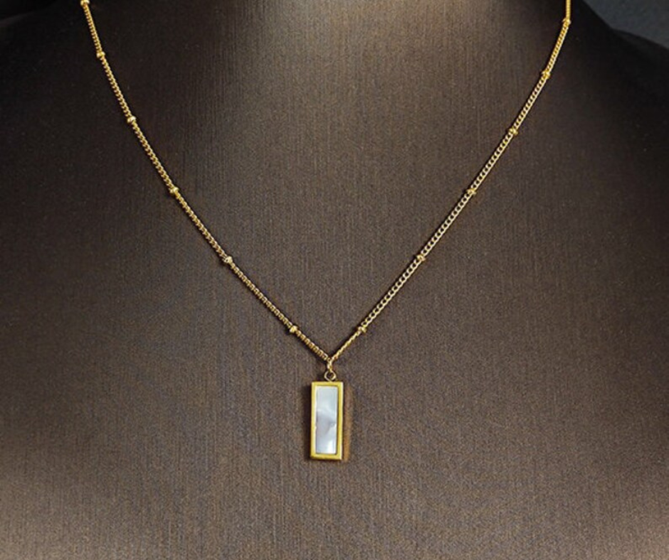 "Elegance Reversed" β White & Black Double-Sided Marble Pendant Necklace