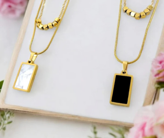 "Elegance Reversed" – White & Black Double-Sided Marble Pendant Necklace